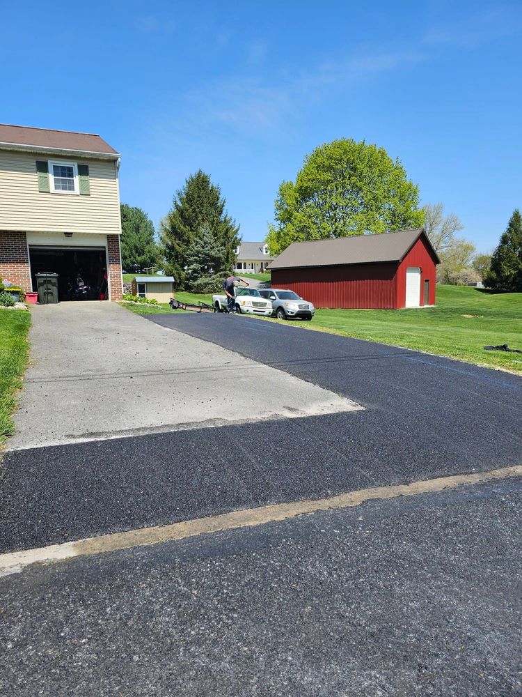 Our Patching service expertly repairs cracks and potholes in your asphalt, ensuring a smooth, durable surface that enhances safety and extends the lifespan of your driveway or pavement. for Warwick Paving in Lititz, PA
