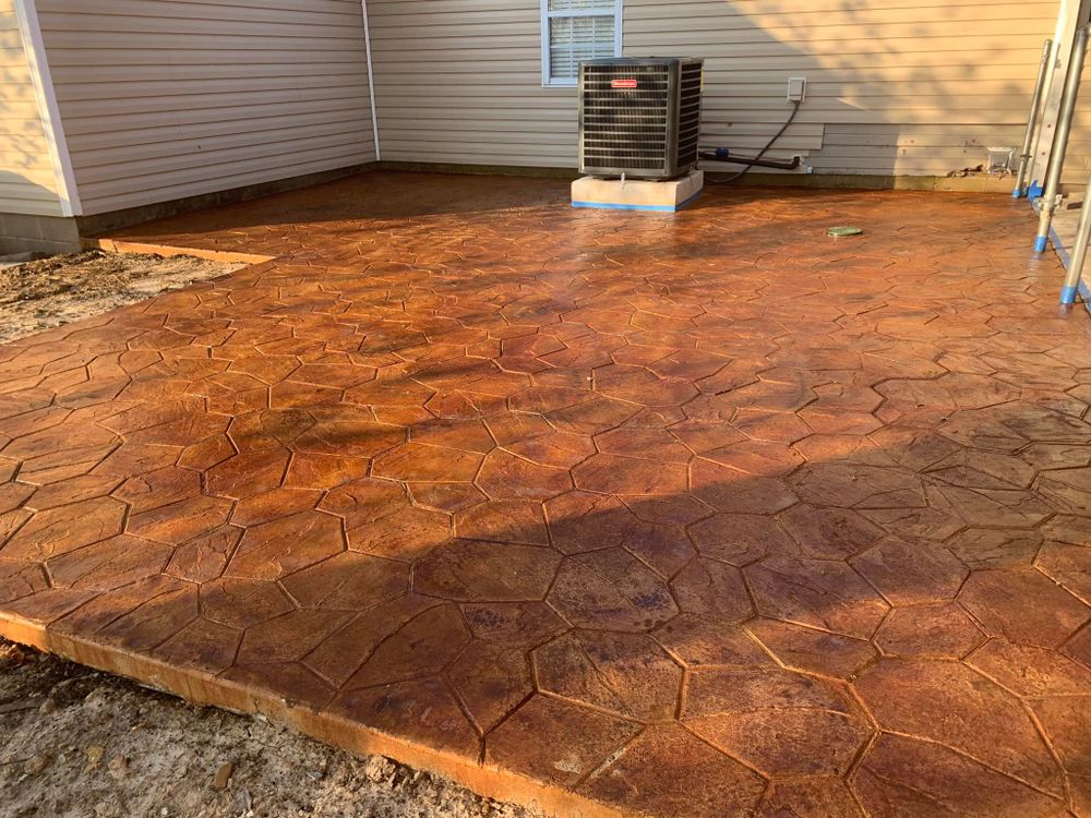 Transform your outdoor space with our expert stamped concrete installation, offering beautiful, durable surfaces that mimic natural stone at a fraction of the cost. Enhance your home’s curb appeal effortlessly. for R&C Concrete in Jonesboro, AR