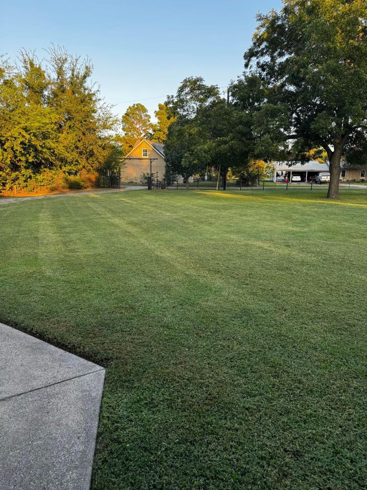 Our professional mowing service will keep your lawn neat and healthy, providing consistent maintenance for a lush green yard that enhances the beauty and value of your home. for Keener's Lawn and Landscape LLC in Quitman, TX