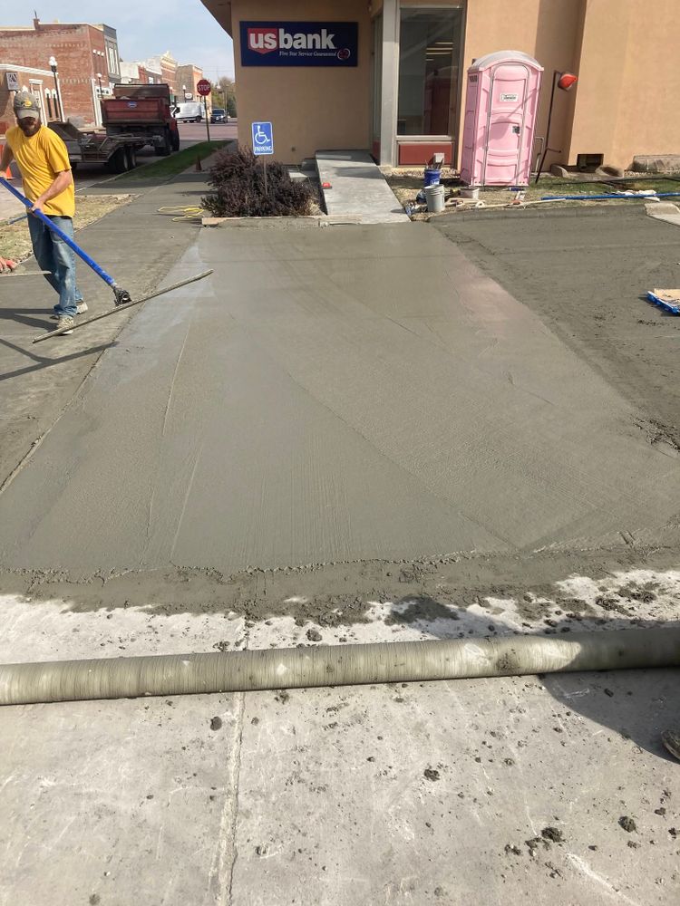 Our Concrete Parking Lot Construction service offers durable, long-lasting solutions tailored to enhance functionality and curb appeal for residential driveways, providing a sturdy foundation that withstands weather and heavy usage. for Bishop Asphalt Sealcoating in Marceline, MO