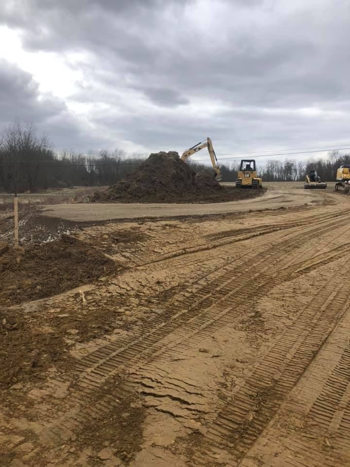 Our expert Leveling service precisely evens out land surfaces, ensuring perfect groundwork for construction projects. Designed to enhance site stability and drainage, it provides a seamless start to any building endeavor. for ASC Excavating LLC in Lucas, OH