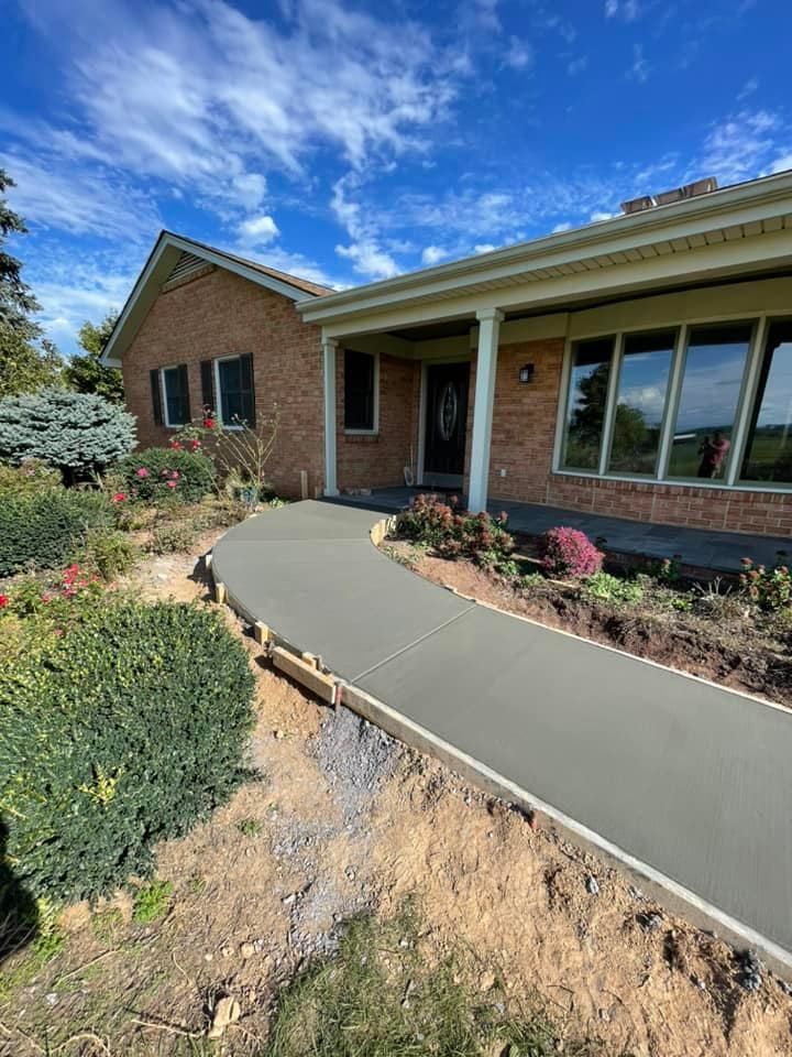 Enhance your home with our expert sidewalk installation service, providing durable, aesthetically pleasing concrete pathways designed to increase safety and curb appeal for any residential property. Enjoy professional craftsmanship tailored to your landscape. for Top Finish Concrete LLC in Harrisonburg, VA