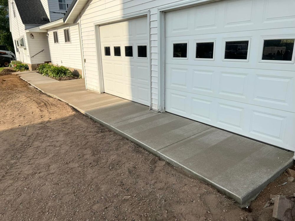 Our concrete services offer durable, customizable concrete garages that enhance your home's functionality and aesthetics, providing secure storage solutions built to withstand the test of time. for Johnsons Custom Creations in Milaca, MN