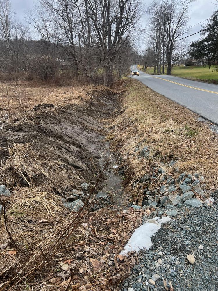 Enhance your property with our professional land grading service, ensuring a level foundation for construction, improved drainage, and increased landscape aesthetics for a safer and more visually appealing outdoor space. for A & J Excavation inc. in Central Bridge, NY
