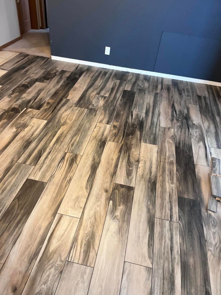 Transform your space with our expert flooring services, offering a wide range of high-quality materials and professional installation to enhance the beauty and functionality of your home. for PKC Construction in Sterling, IL