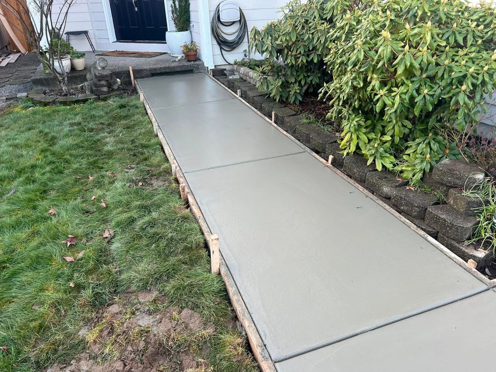 Enhance your home's curb appeal and safety with our professional sidewalk installation service, featuring durable concrete designs crafted to withstand weather elements while seamlessly blending with your landscape for lasting beauty. for Solid Concrete Contractor  in Tacoma, WA