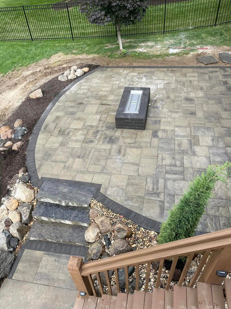 Our Fire Pit Installation service provides homeowners with professional, hassle-free installation of beautiful fire pits in their outdoor spaces, enhancing the overall ambiance and enjoyment of their property. for Hardscapes of Nebraska in Arlington, NE