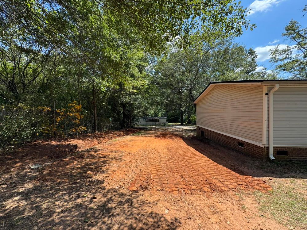 Our Leveling service ensures your property is perfectly graded, promoting proper drainage and a solid foundation for future construction or landscaping needs. Enhance safety and beauty with our precise leveling solutions. for O'Connor Clearing and Hauling LLC in Anderson County, SC