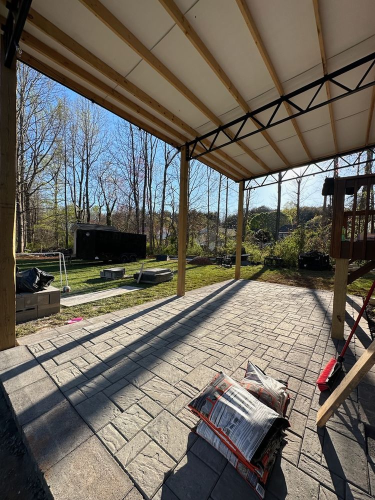 Enhance your outdoor living with our patio design & construction service, offering custom solutions that blend functionality and aesthetics for a perfect backyard retreat tailored to your lifestyle and preferences. for Platinum Outdoor Services LLC in Conover, NC