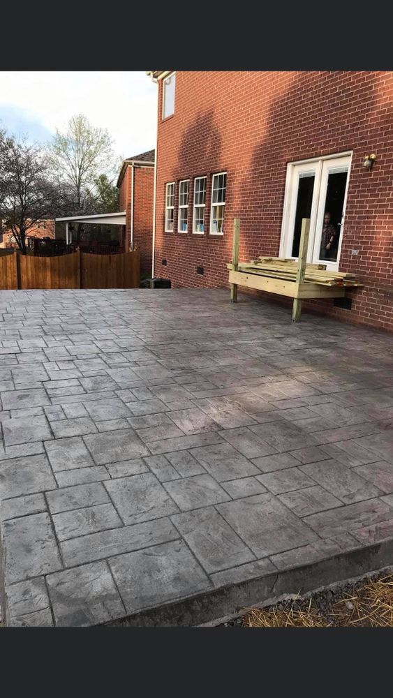 Our expert team specializes in creating beautiful and durable outdoor living spaces using high-quality concrete materials, perfect for adding functionality and aesthetic appeal to your home's exterior. for Tac Concrete in Shelbyville, TN