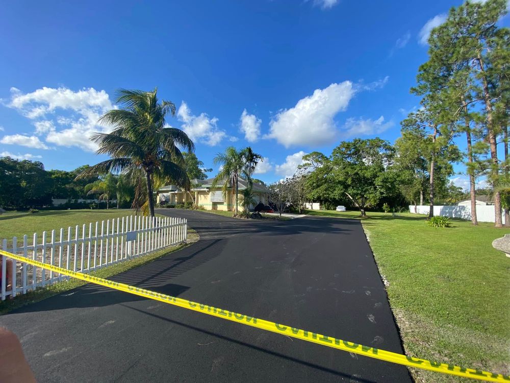 Our Asphalt Installation service delivers durable, smooth surfaces for driveways and pathways, combining expert craftsmanship with high-quality materials to enhance your home's curb appeal and ensure long-lasting performance. for PavePros in West Palm Beach, FL