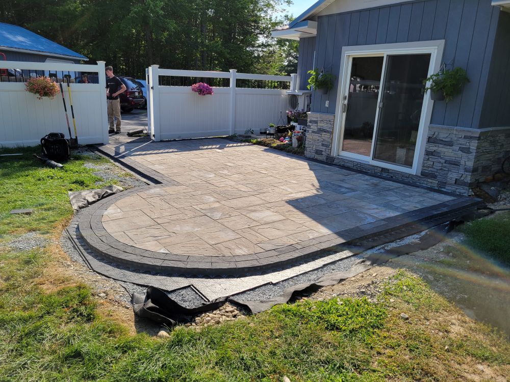 Our patio service designs and builds beautiful, durable outdoor living spaces tailored to your home, combining expert craftsmanship, quality materials, and functional layouts that enhance comfort, value, and everyday enjoyment. for Casey's Lawn Service LLC in Orono, ME