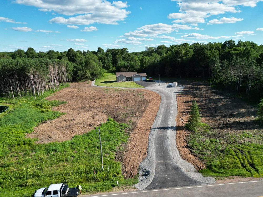 Enhance your home with our expert driveway construction service, combining durable materials and skilled craftsmanship to ensure a long-lasting, aesthetically pleasing addition that complements your property’s natural surroundings. for Brush Busters in Wausau, WI