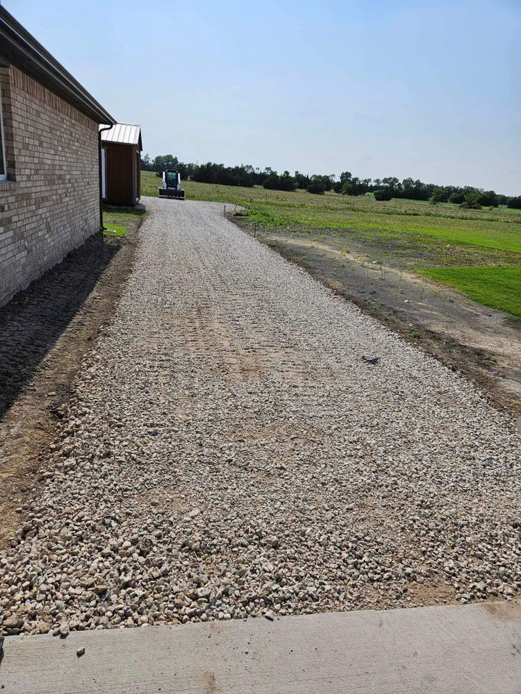 Our driveway construction service includes grading, compacting, and paving with quality materials to ensure a smooth and durable surface that enhances your property's aesthetic appeal and functionality. for Sand And Gravel Solutions in Nevada, TX