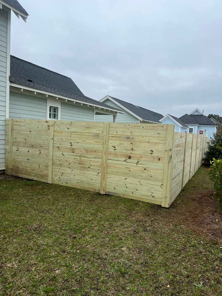 Enhance your home's security and aesthetics with our professional fencing service. We offer a wide variety of styles and materials to suit your preferences and improve your property value. for Cisne's LLC in Charleston, SC