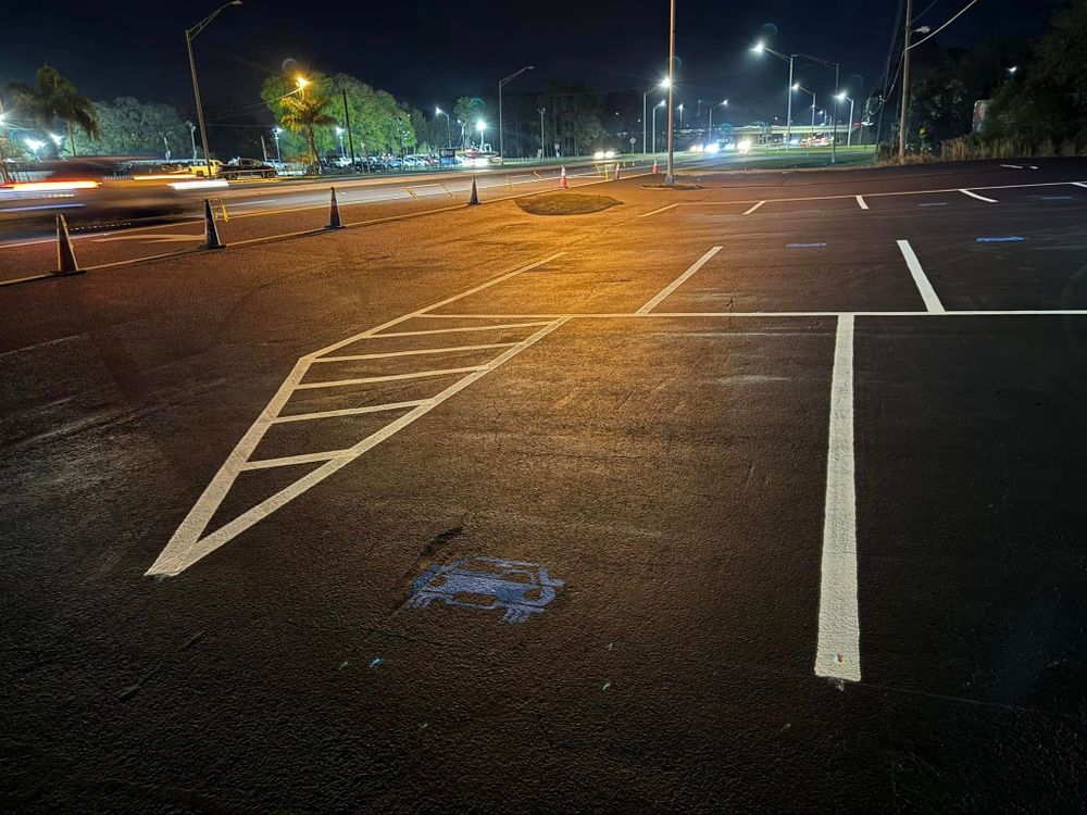 Our Asphalt Parking Lot Construction service ensures durable, smooth, and aesthetically pleasing surfaces for residential properties. Trust our expert team to enhance your home's curb appeal with high-quality materials and professional craftsmanship. for Pavesheild in Haines City, FL