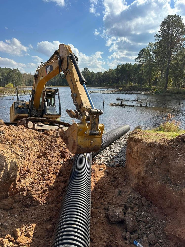 We specialize in the installation of storm drains and culverts, ensuring effective water flow management and preventing flooding with expert design and precise construction. for JUSTIN JACQUES LLC DBA DOUBLE J EXCAVATION in Nashville, AR