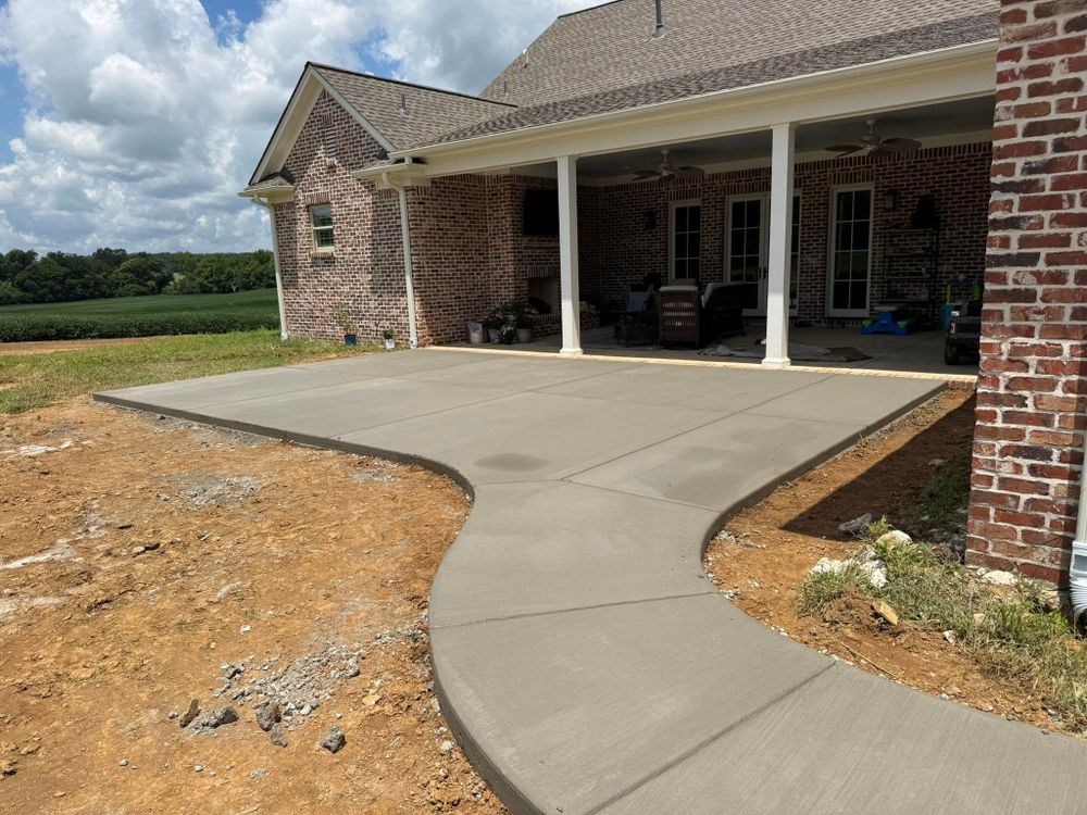 Enhance your home's curb appeal with our professional sidewalk installation service, offering durable and aesthetically pleasing concrete pathways that ensure both safety and style for your outdoor spaces. for Ramsey Concrete Construction in Covington, TN