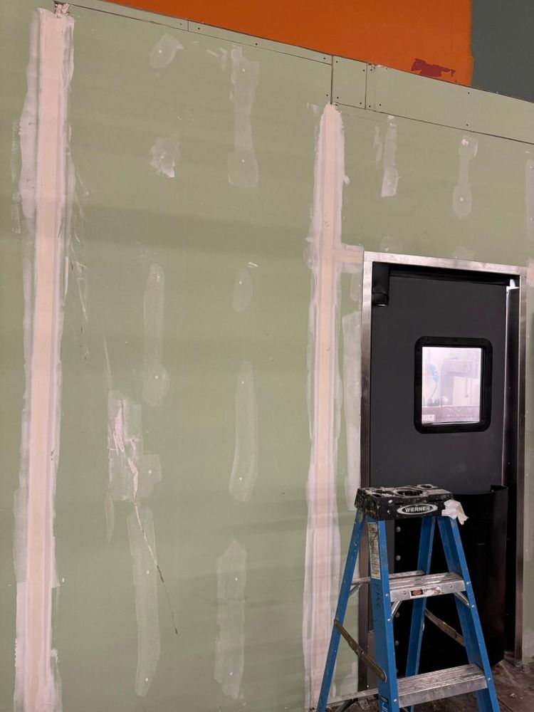 Our Drywall Repair service efficiently restores walls to their original condition, addressing cracks and holes with precision, ensuring a seamless finish that enhances your home's beauty and structural integrity. for New Era Construction & Services LLC in Manchester, NH