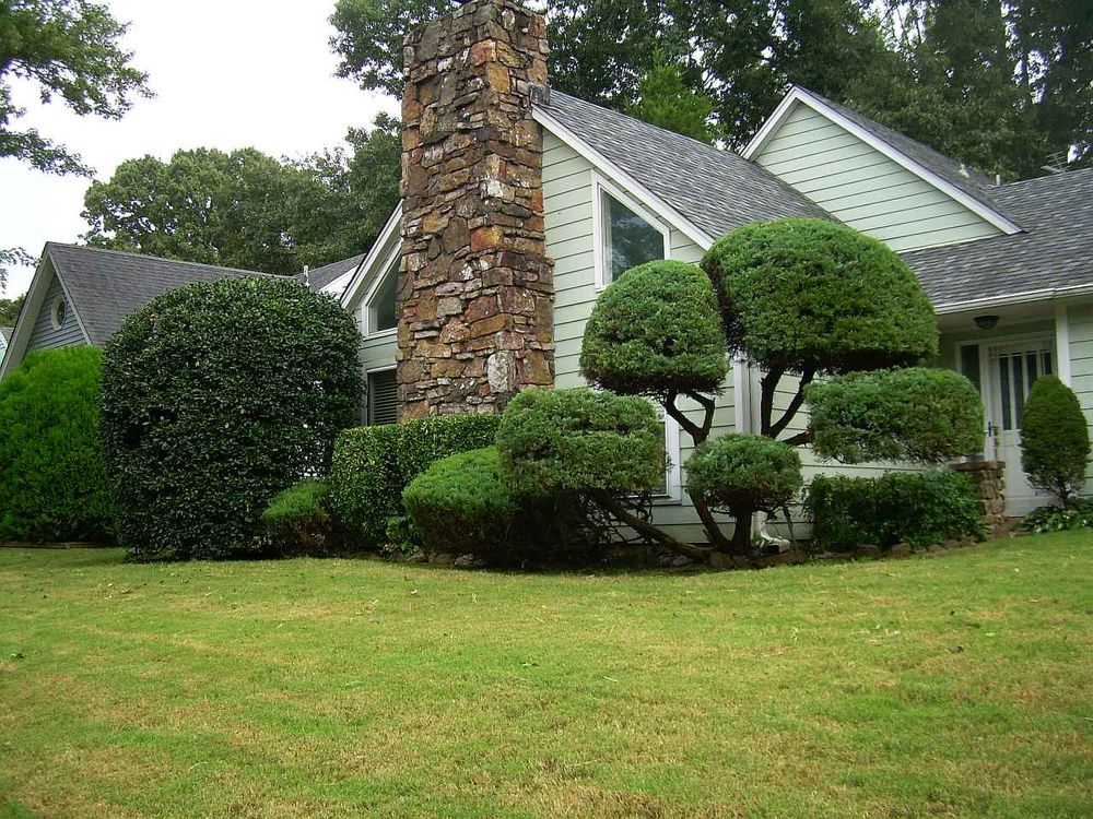 Our professional shrub trimming service will enhance the beauty of your landscape by shaping and maintaining the bushes around your home, creating a polished and attractive outdoor space for you to enjoy. for Grassy Turtle Services, LLC.  in Oxford, CT