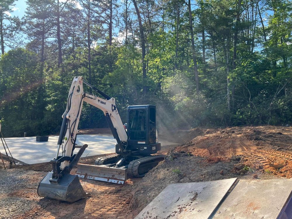 Our Foundation Digging service ensures precise and reliable groundwork, providing a stable base for your construction project with expert excavation techniques tailored to fit your specific needs and site requirements. for OCD Landworks in Lenoir, NC