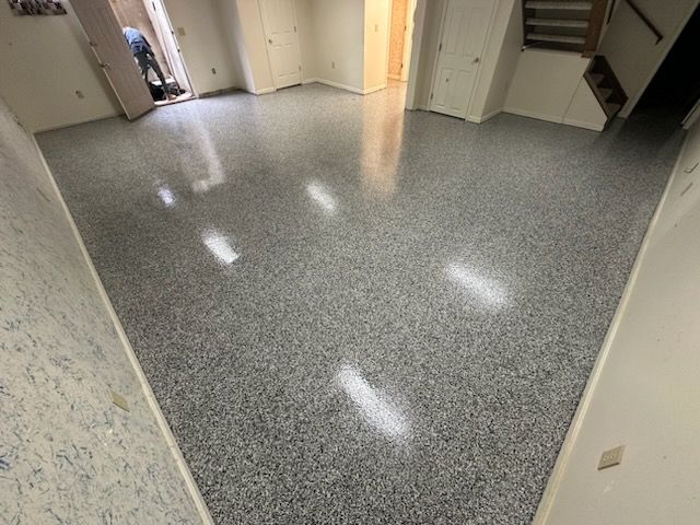 Our high-quality epoxy flooring service transforms ordinary concrete floors into durable, stylish surfaces that are easy to clean and maintain, enhancing the beauty and functionality of your home. for Tanenbaum Services & Concrete in Florence, KY