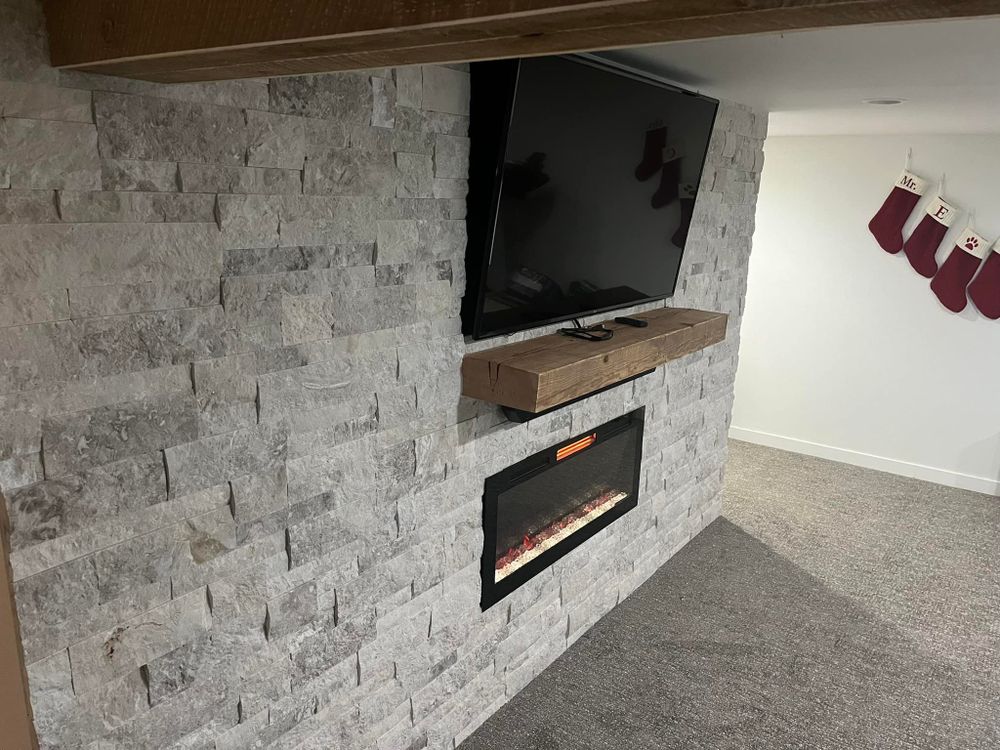 Enhance your property with our expert stone wall installation services. Our team meticulously designs and builds durable, aesthetically pleasing walls that complement any landscape, ensuring quality craftsmanship for lasting beauty and functionality. for Elite Fire & Stoneworks in Hawley, MN