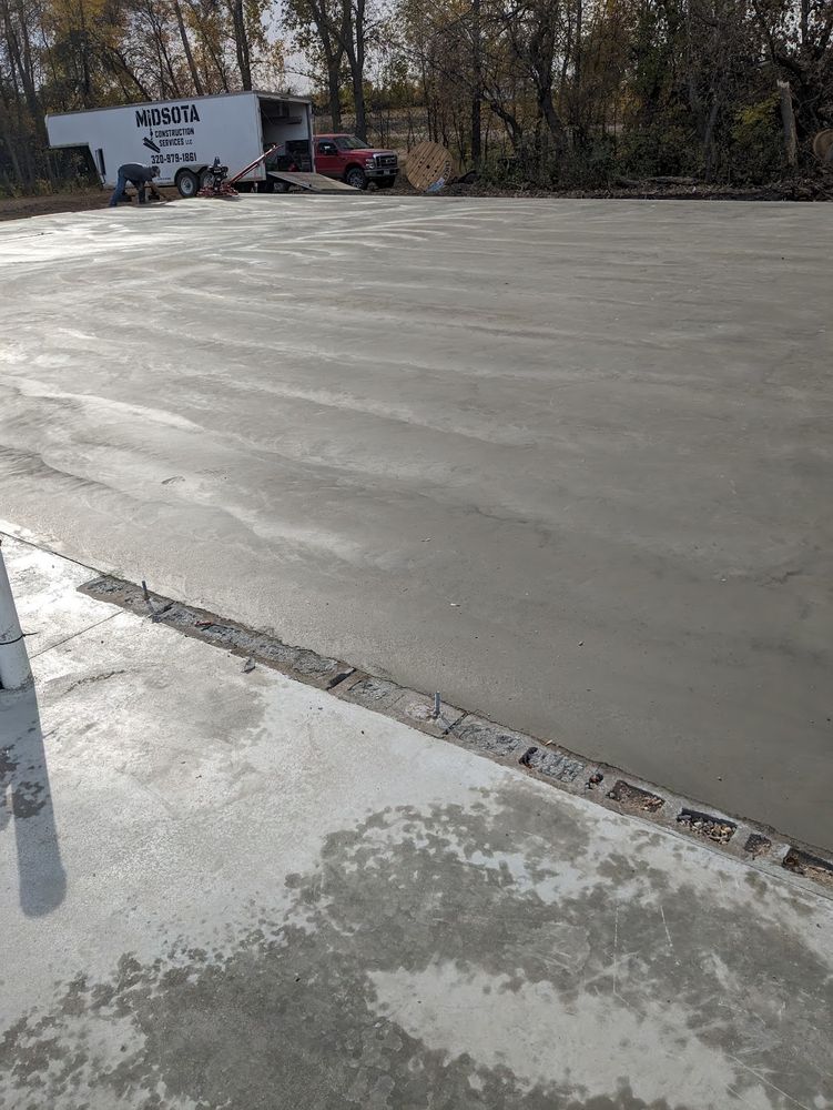 Enhance your home with our expert sidewalk installation service, providing durable, aesthetically pleasing concrete pathways designed to complement your exterior and ensure safety, longevity, and curb appeal for any property. for Midsota Construction Services in Kerkhoven, MN