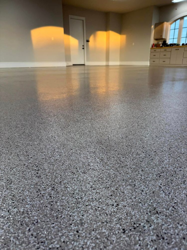 Enhance your home's flooring with our Polyaspartic Floor Coating, offering exceptional durability, rapid curing times, and a sleek finish that resists stains and abrasions for long-lasting beauty and protection. for Mitchell’s Concrete Coatings in Taylorsville, NC