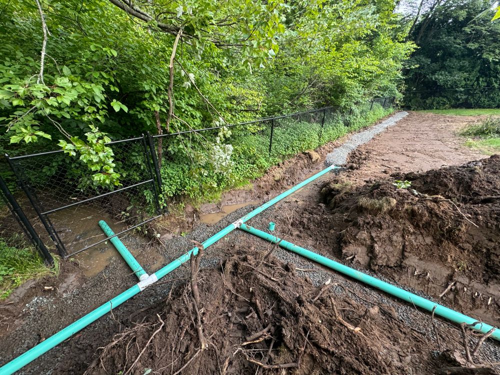 Lennon Land Management specializes in water management solutions. We tailor drainage plans specific to your property including pipe installation & waterway construction. for Lennon Land Management in Suffield, CT