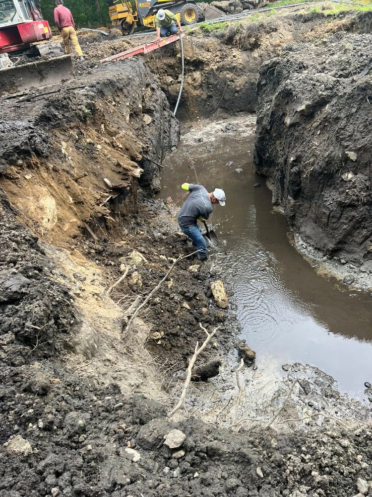 Our trenching and utilities installation service safely excavates for water, sewer, drainage, gas, and electrical lines, ensuring precise placement, code compliance, minimal disruption, and reliable performance for your property. for Redwood Construction in Cranston, RI