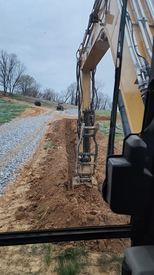 Our trenching service offers precise and efficient digging for utility installations, drainage systems, and landscaping needs. Trust our experienced team to enhance your property's functionality while ensuring safety and minimal disruption. for Watkins Excavation in Robards, KY