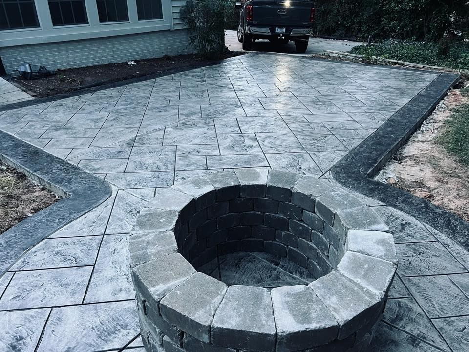 Enhance your backyard with our professional firepit installations, offering seamless integration and durable construction to create a cozy gathering spot that adds charm and functionality to your outdoor space effortlessly. for Rivera Concrete INC. in Greensboro, NC