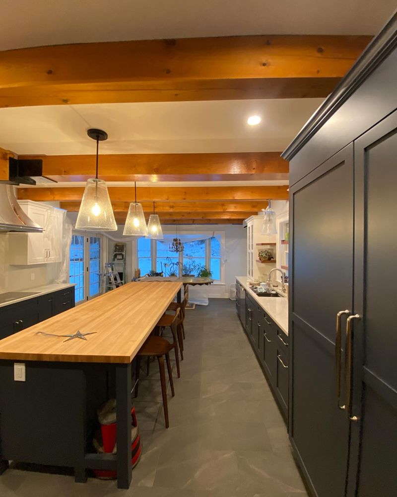 Transform your kitchen with our expert cabinet refinishing service. We revitalize and update the look of your cabinets, providing a fresh, modern appearance without the hassle or cost of replacement. for JBA Painting LLC in Killington, VT