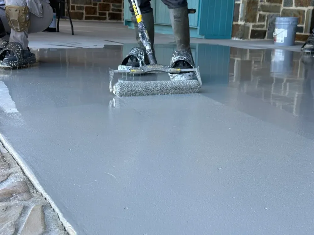 Enhance your home's curb appeal with our expert concrete paint services, providing durable and stylish finishes that protect and beautify patios, driveways, and walkways for long-lasting surface perfection. for Deluxe New World Painting Company  in Cheboygan, MI