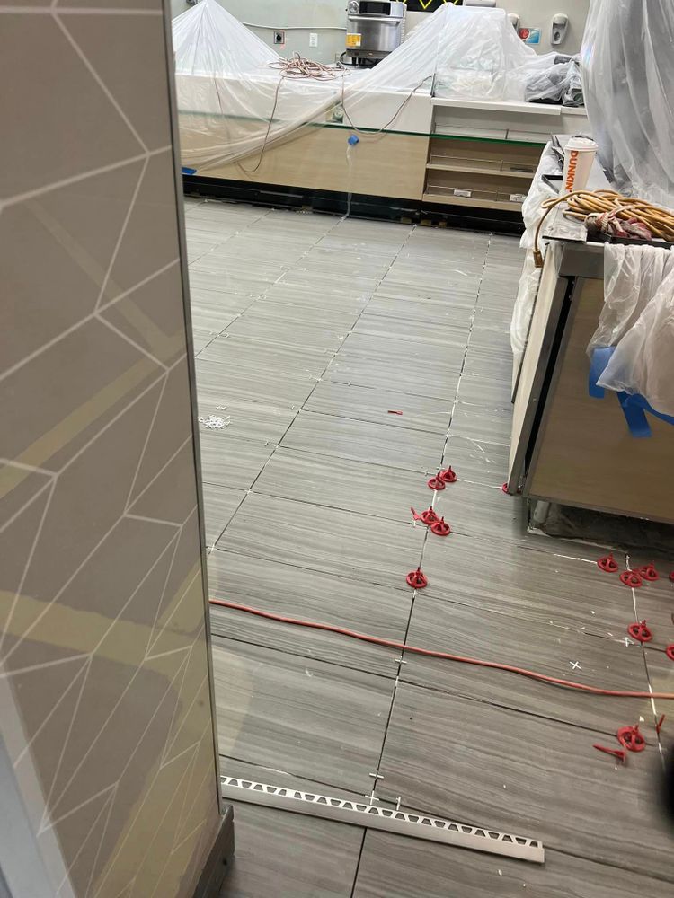 Our Commercial Flooring service offers homeowners professional installation, maintenance, and repair of high-quality flooring materials specifically designed for commercial spaces. for Premier Tile Contractors LLC in Henrico, Virginia
