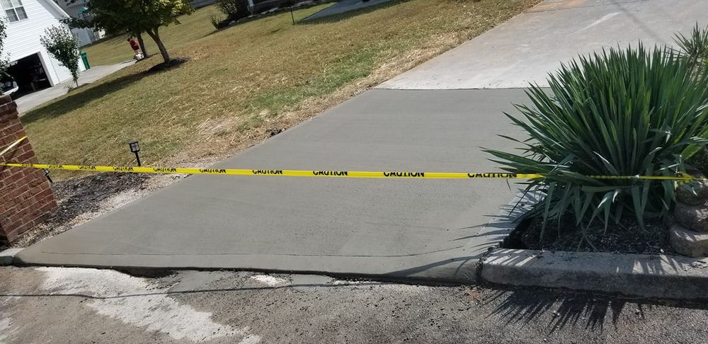 Our Concrete Repair service revitalizes and strengthens damaged surfaces with durable solutions, ensuring safety and extending the lifespan of your driveways, patios, or foundations while enhancing your home's curb appeal. for Tommy Moore Construction in Anderson County, TN