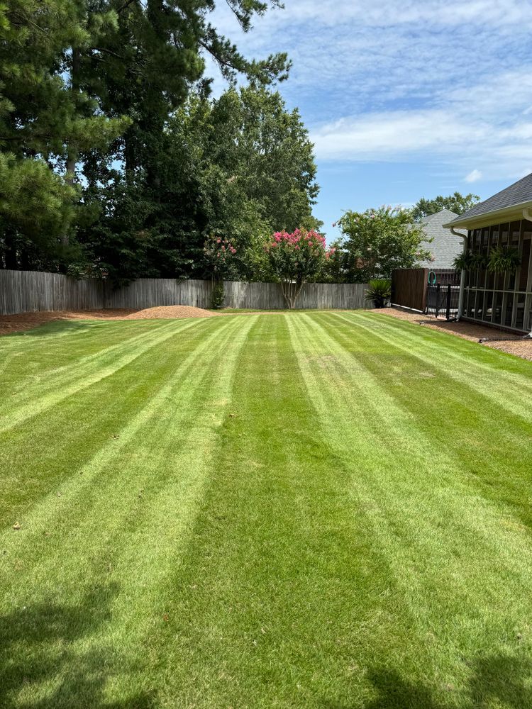 Our lawn care maintenance service ensures your yard stays lush and healthy, with regular mowing, fertilization, aeration, and weed control tailored to your landscape's unique needs for a stunning outdoor space. for Myles Mows in Augusta, GA