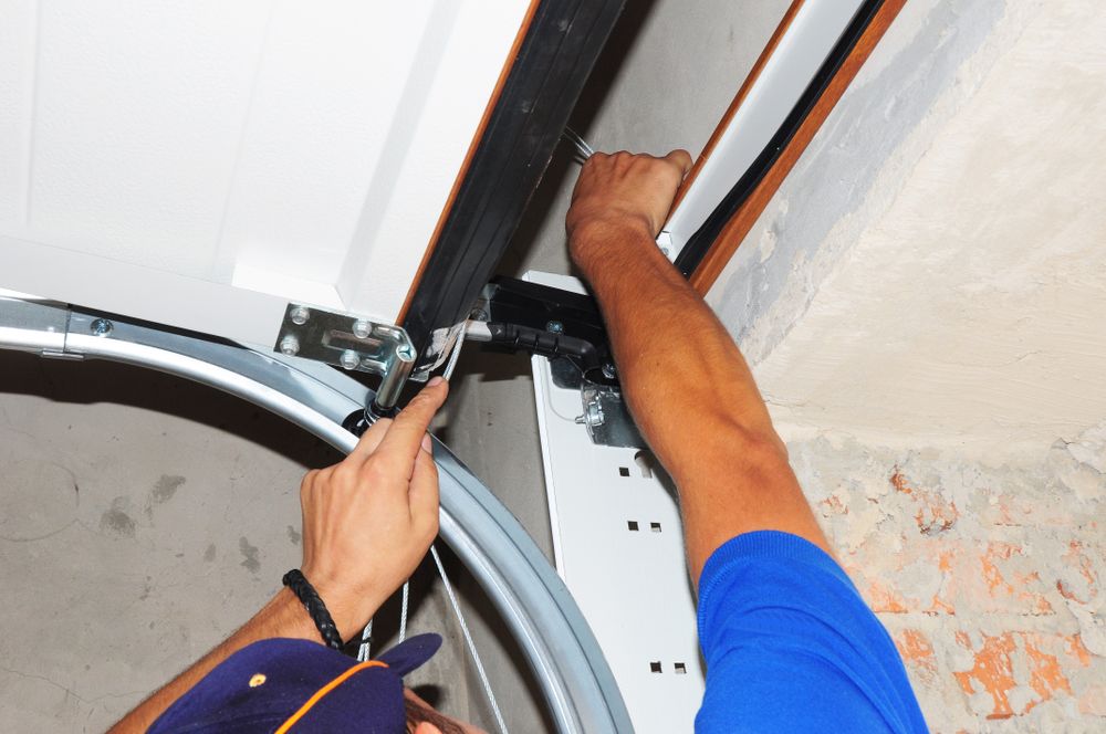 Our expert garage door repair service ensures safe, reliable operation with quick response times, skilled technicians, and high-quality parts to efficiently address any issue your home garage door may encounter. for John's Garage Doors in Littleton, CO