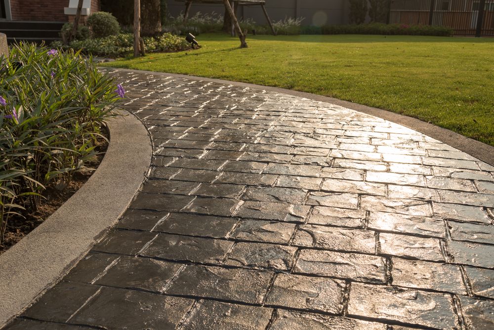 Our Sidewalk Installation service provides durable, professional concrete paths that enhance curb appeal and ensure safety. Trust our skilled team for precision craftsmanship and long-lasting quality in your home's outdoor spaces. for JW Concrete Coating in Bloomington, IL