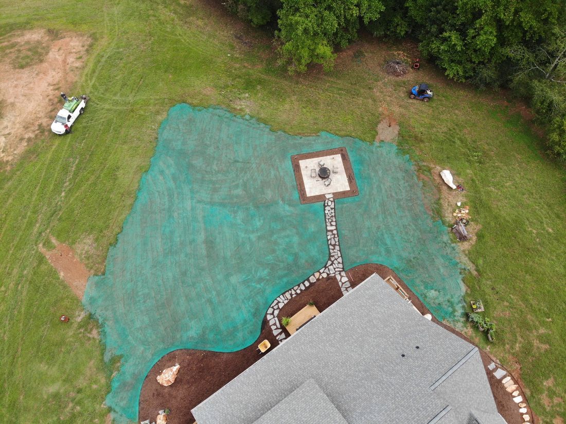 Drone view of a hydroseeded lawn around a house