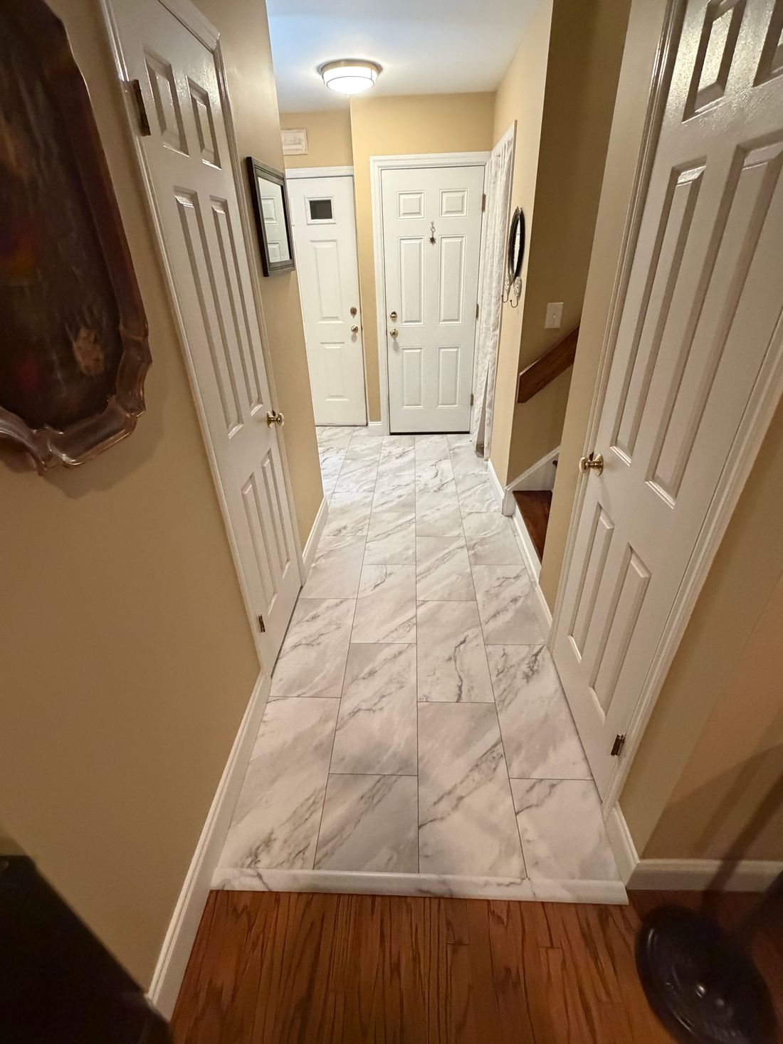 Marble look tile in a hallway