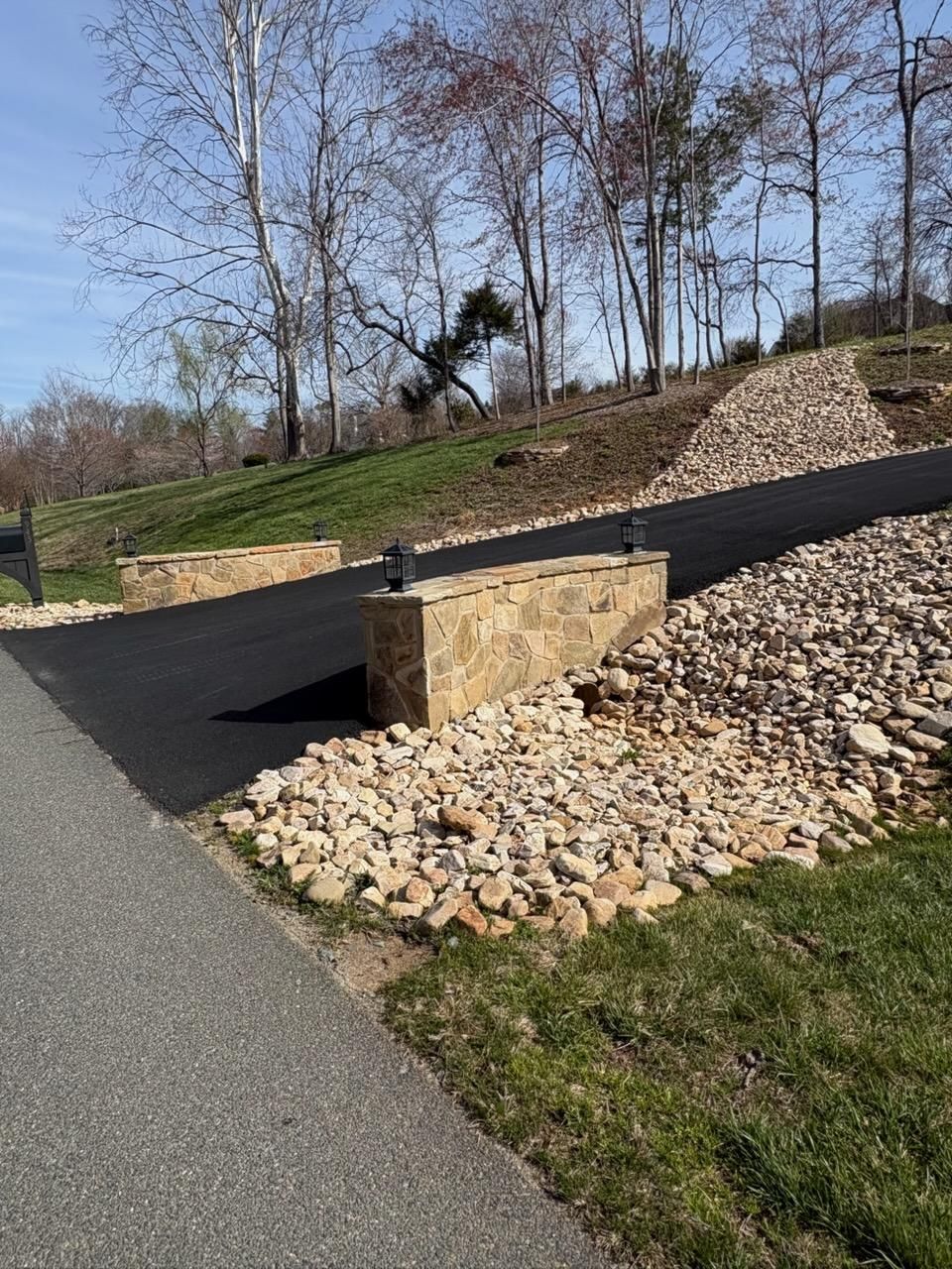 Culvert with a stacked rock headwall along a driveway