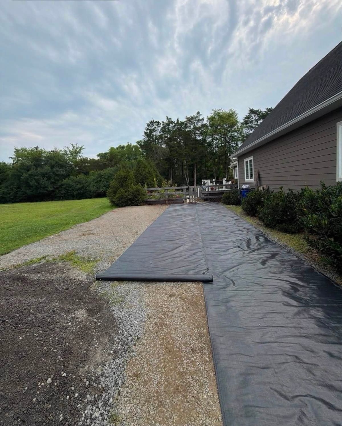 Driveway with landscape fabric laid down before new millings