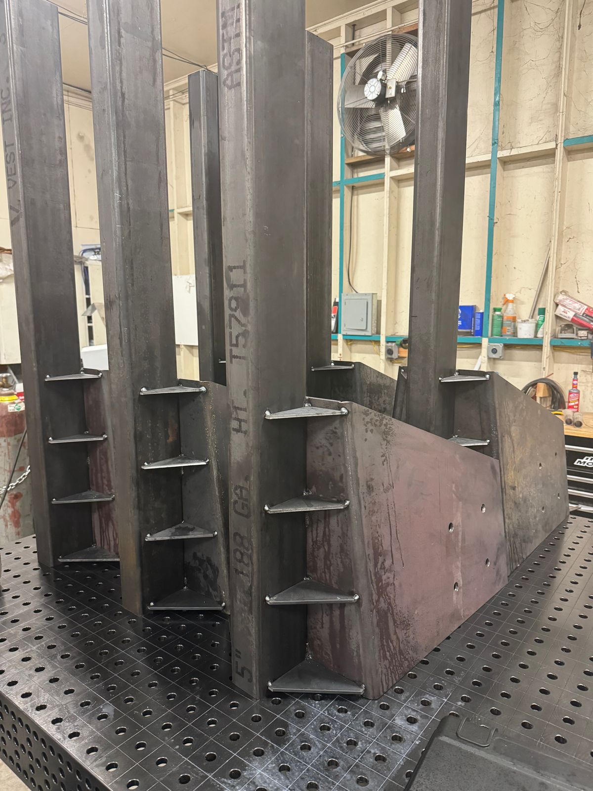Heavy steel weldment with gussets on the fixture table