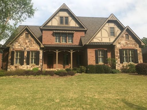 Brick and stone craftsman with a new roof