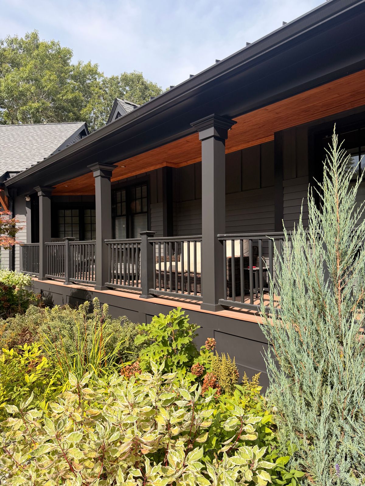 Porch and trim repainted on a dark gray house