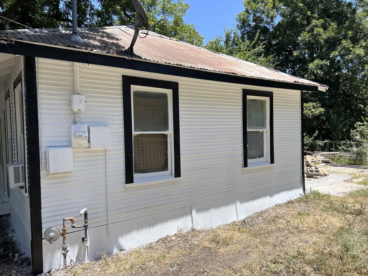 The same elevation after repainting with crisp black window trim