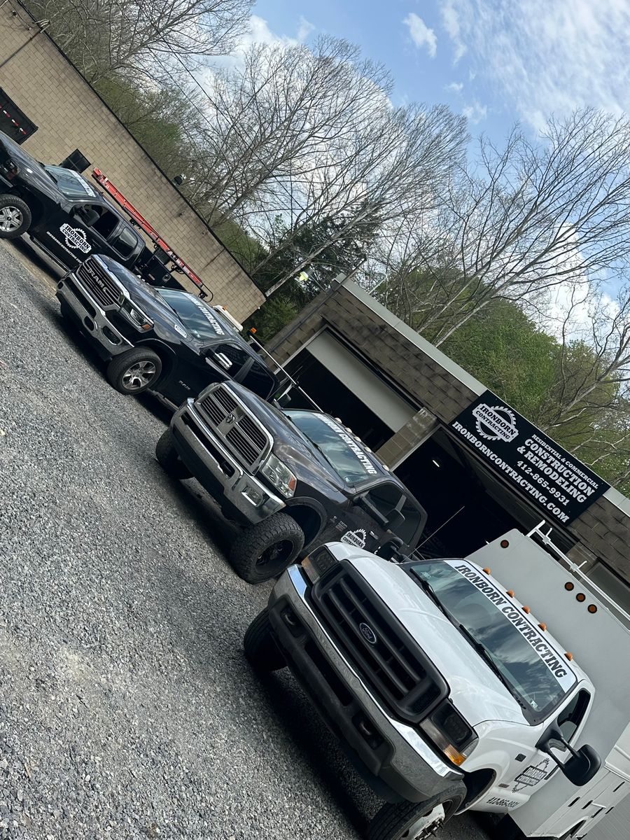 Ironborn Contracting trucks lined up outside the company shop