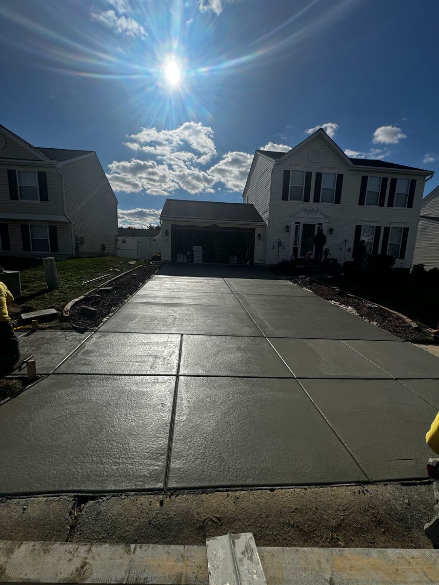 Freshly poured concrete driveway with control joints